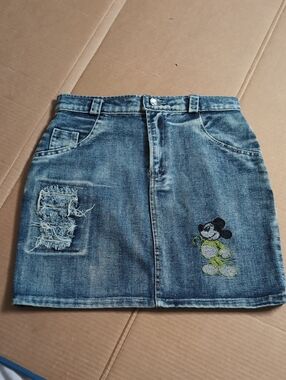 Distressed Light Wash Denim Skirt with Embroidered Graphic